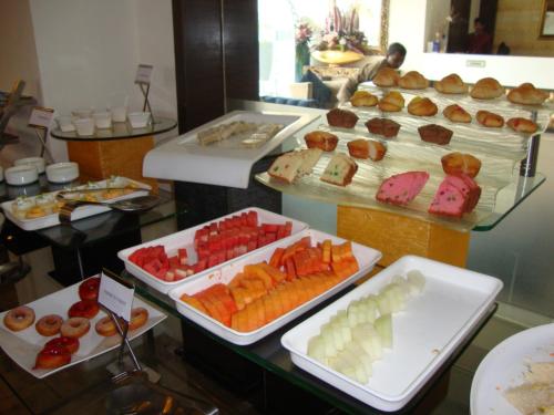 a buffet with many different types of fruits and pastries at Best Western Maryland in Chandīgarh