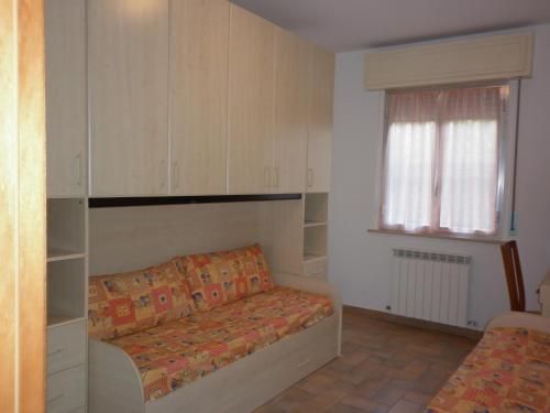 A bed or beds in a room at Villa Jolanda