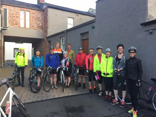 a group of people posing for a picture with their bikes at Scotch Arms Mews Bed & Breakfast in Brampton
