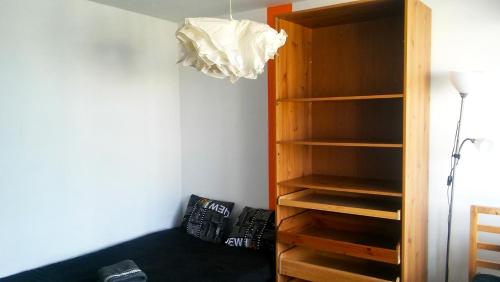 a room with a book shelf and a lamp at Walk distance to mokotow business park in Warsaw