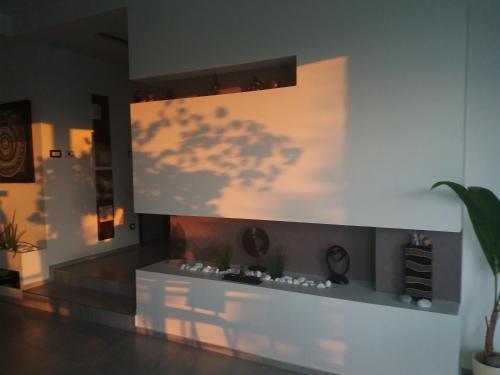 a living room with a wall with a cloud mural at Private Family Villa in Budaörs