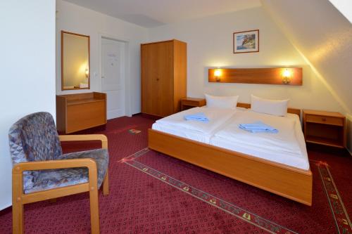 Ein Bett oder Betten in einem Zimmer der Unterkunft Phoenix Hotel Schäfereck