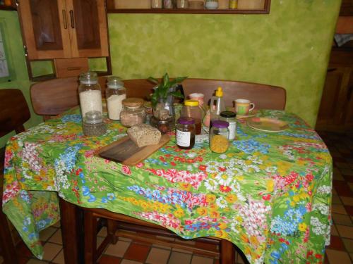 a table with a colorful table cloth with food on it at "Dulces Sueños" in Cochabamba