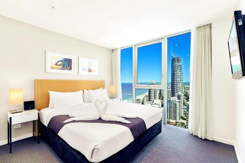 En eller flere senger på et rom på H Luxury Residence Apartments - Holiday Paradise