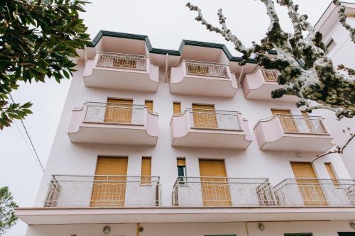 a building with balconies on the side of it at Hotel Villa Claudia in Bellaria-Igea Marina