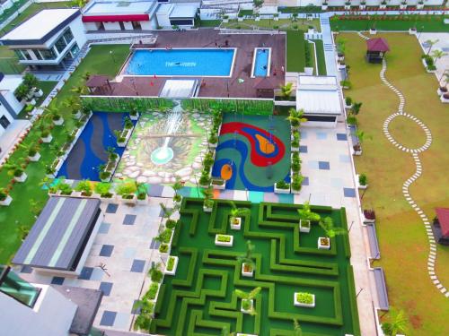 an aerial view of a resort with a swimming pool at City Life by J&G Vacation Homes in Skudai
