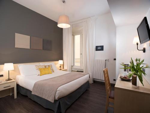A bed or beds in a room at 111 ColaDiRienzo Rooms - by AD Roma