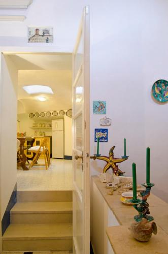 a hallway with a door leading to a dining room at Antico Monastero Di Anacapri in Anacapri