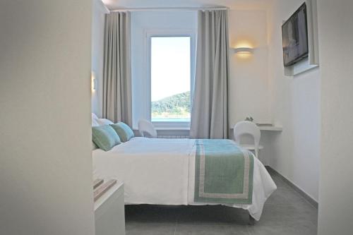 En eller flere senge i et værelse på L'Ancora