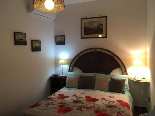 Ein Bett oder Betten in einem Zimmer der Unterkunft B&B Villa Piera Montecucco