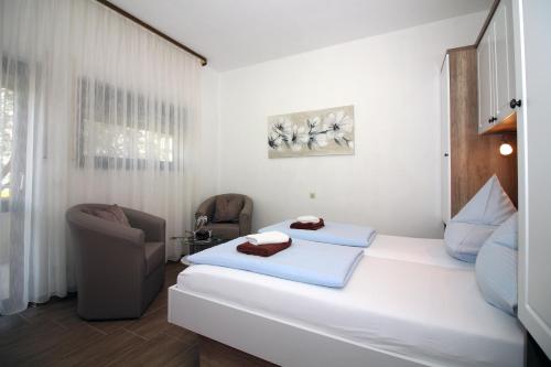 Postel nebo postele na pokoji v ubytování Apartmani Amado/Lozic