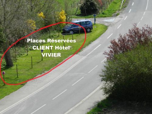 a car parked on the side of a road at Hôtel Le Vivier WISSANT - Vue Mer - Côte d'Opale - Baie de Wissant - 2CAPS in Wissant