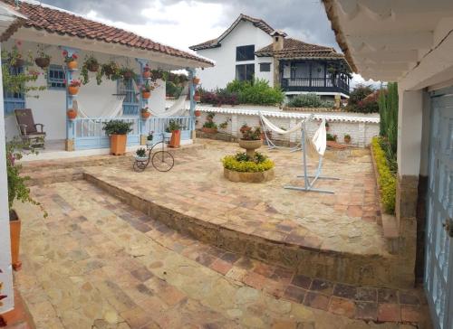 a courtyard of a house with a patio at Casa Hotel Santa Helena Boutique in Villa de Leyva