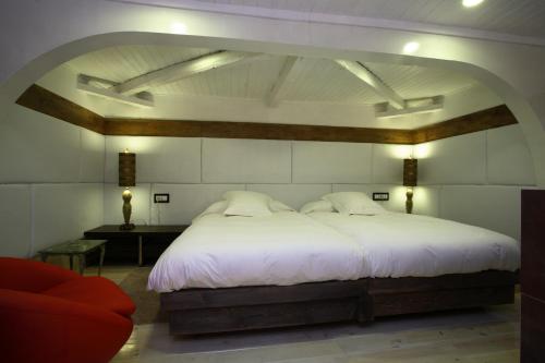 Katil atau katil-katil dalam bilik di Hotel Boutique Palacio de la Serna
