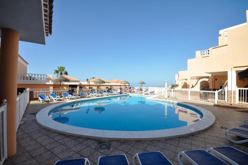 Bazén v ubytovaní Paradise Court Las Americas WiFi Pool 25 alebo v jeho blízkosti