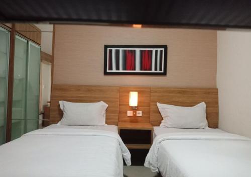 Postel nebo postele na pokoji v ubytování Marrakesh Inn