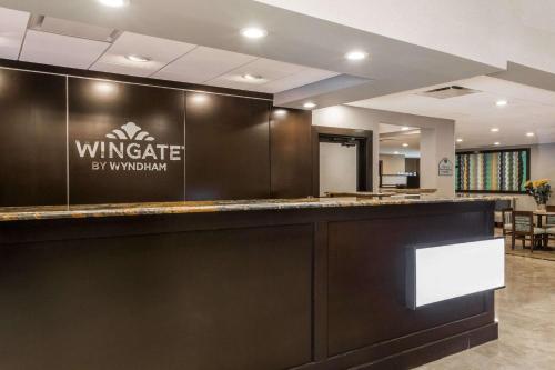 a kitchen with a stainless steel counter top at Wingate by Wyndham - Universal Studios and Convention Center in Orlando