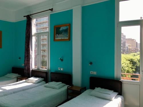 Postel nebo postele na pokoji v ubytování Hotel Kastoria