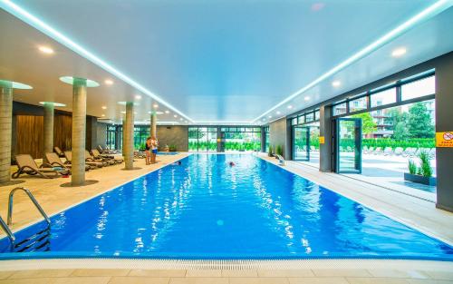 Bazén v ubytovaní Aqua Holiday Apartments Beach#Pool#Sauna no limit alebo v jeho blízkosti