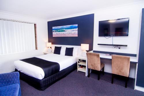 Postel nebo postele na pokoji v ubytování Crescent Motel Taree