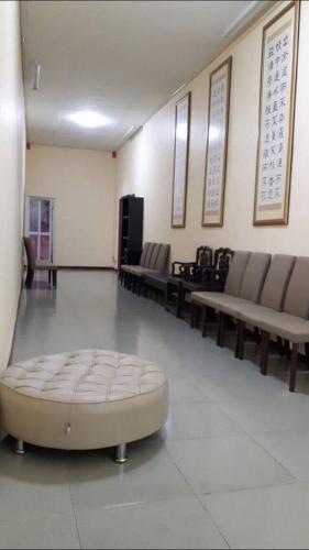 a large room with couches and a large ottoman at Happy Paradise in Kampung Janda Baik