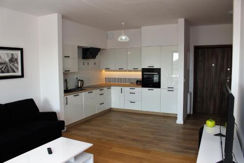 Кухня или мини-кухня в Apartamenty Przy Latarni Kropla Bałtyku
