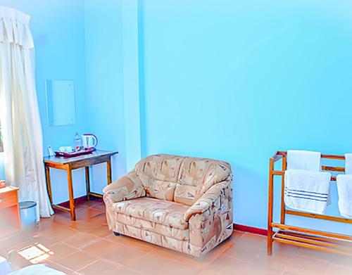 a living room with a couch and a table at Villu Villa in Anuradhapura