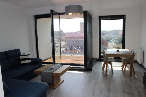 Гостиная зона в Apartamenty Przy Latarni Kropla Bałtyku