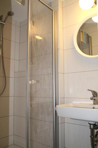 a bathroom with a shower and a sink at Am Küstenwald in Koserow