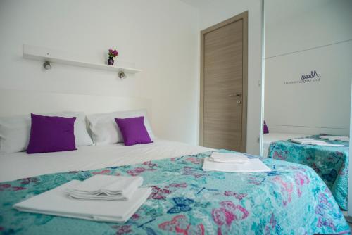 Postel nebo postele na pokoji v ubytování Apartments Svijet Mora 2