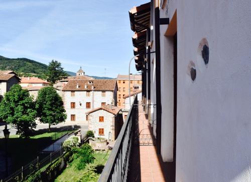 a view of a city from a balcony of a building at Apartamentos Turísticos Rincones del Vino in Ezcaray
