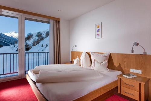 Giường trong phòng chung tại Hotel Garni Auriga