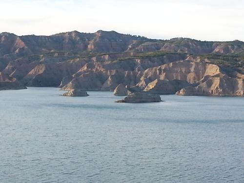 a large body of water with mountains in the background at Cueva Las Yeseras in Baza