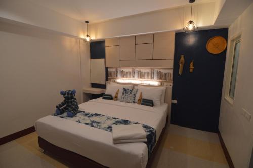 a hotel room with two beds in a room at UD Capital Hotel in Udon Thani