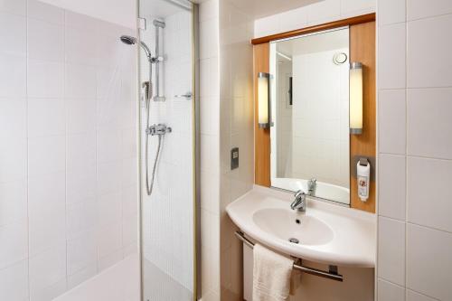 a bathroom with a sink and a shower at ibis Birmingham Centre New Street Station Hotel in Birmingham