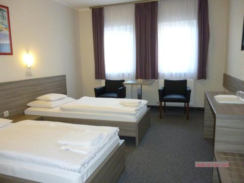 Postel nebo postele na pokoji v ubytování Paprika M1 Hotel