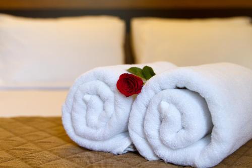 Ένα ή περισσότερα κρεβάτια σε δωμάτιο στο Sanctum Suites Whitefield Bangalore
