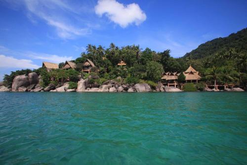 a group of houses on a island in the water at Koh Tao Cabana in Koh Tao