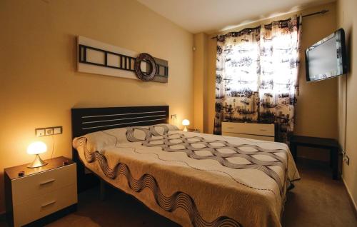a bedroom with a large bed and a window at Sierra Cortina Resort in Finestrat