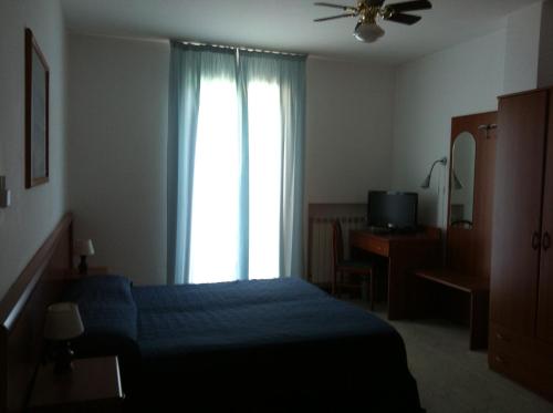 Un pat sau paturi într-o cameră la Ulivo