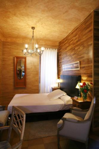 Katil atau katil-katil dalam bilik di Hotel Boutique Palacio de la Serna
