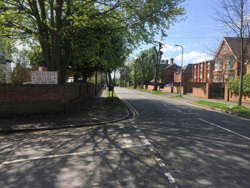 an empty street with a sign on the side of the road at Crescent Hotel in Reading