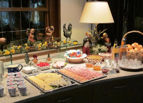 a buffet of food on a table with other foods at Gasthof Rodachtal mit Gästehaus Katharina in Schwarzenbach am Wald