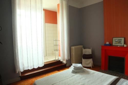 Katil atau katil-katil dalam bilik di La chambre d'hotes du Parc