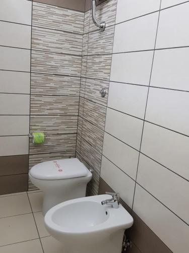 a bathroom with a toilet and a sink at B&B Dimora del centro in Scalea