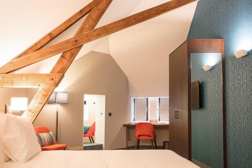 Llit o llits en una habitació de Hotel de Koppelpaarden