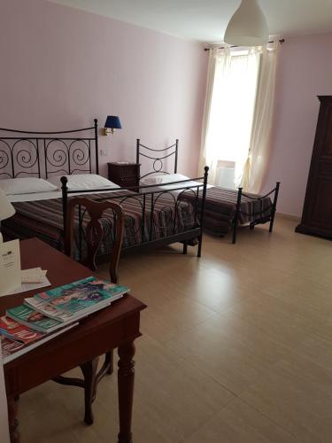Cama ou camas em um quarto em Hotel Posta