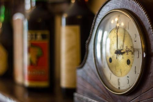 a wooden clock sitting on top of a table at Ristorante Buasca in Cuorgnè