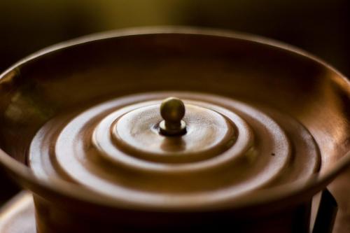 a close up of a metal bowl with a stopper at Ristorante Buasca in Cuorgnè