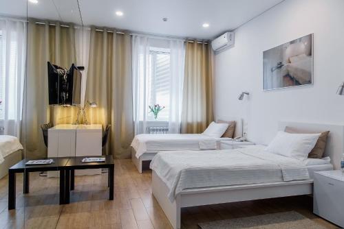 Säng eller sängar i ett rum på Hotel Prizma
